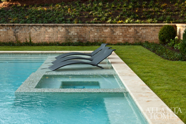 The homeowner enlisted Land Plus to transform the backyard into an entertaining space. The lounge furniture is from Restoration Hardware.