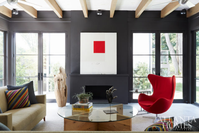 The sunroom of architects Todd Pritchett and Craig Dixon’s bungalow offers a stylish window into their home: clean and contemporary but full of character. Sofa, Ligne Roset. Chair, DWR. Custom coffee table, Jeff Jones Design.
