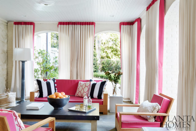 The outdoor lounge’s bright hues are a nod to the wife’s Bermudan roots. Seating, Restoration Hardware. Cushions, custom through Urban Decors in Pindler’s pink Harrow Fresa fabric.
