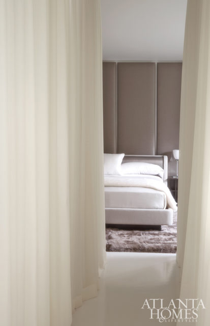 100 yards of custom sheer wool drapery by C&C Drapery envelop the bedroom, creating a peaceful escape.