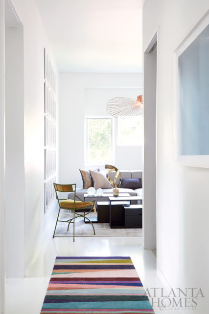 Designers Bill Musso and Seth van den Bergh transformed this condo for fashion-loving clients Jeffrey and Felix. Runner by Paul Smith for The Rug Company.