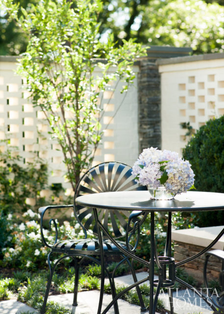 An outdoor fountain and seating arrangement—reminiscent of a spa setting—is accessed from the master suite, a wish-list item from the homeowners.
