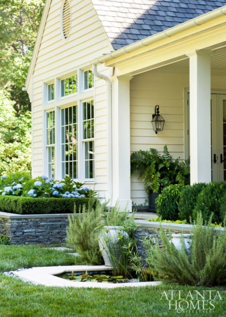 The couple requested a lily pond off the covered terrace for its soothing sound properties while relaxing outdoors.