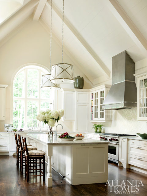 McLean tapped kitchen designer Laurie Lehrich for this voluminous space. Given the room’s grand proportions, Lehrich extended the range hood up into the vaulted ceiling. Baker clad the ceiling in shiplap to achieve a relaxed, informal look. The cabinetry is by Design Galleria Kitchen and Bath Studio. Stools, Holland & Company. Light fixtures, Circa Lighting.