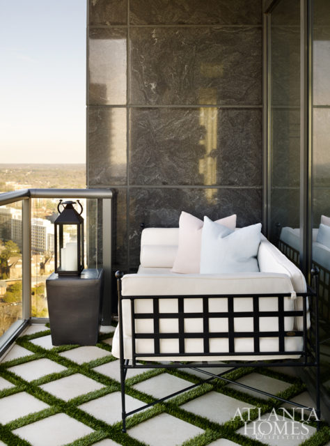 A small daybed on the balcony is perfect for outdoor lounging.