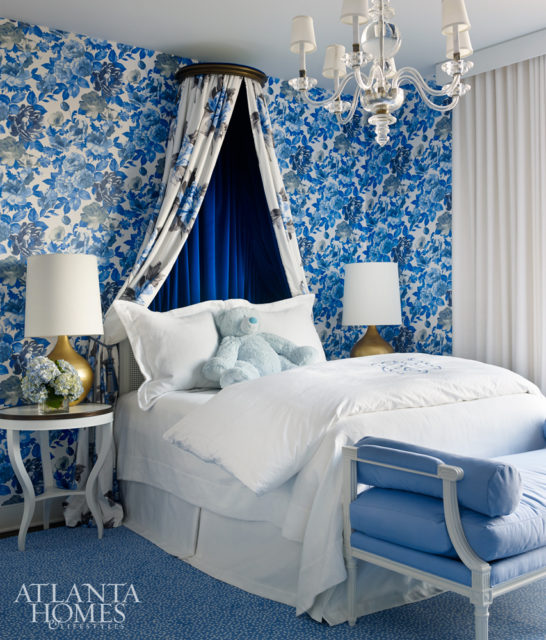 A vibrant wallcovering by Designers Guild in the daughter’s bedroom is both sophisticated and youthful. A custom crown with draping hangs overhead.