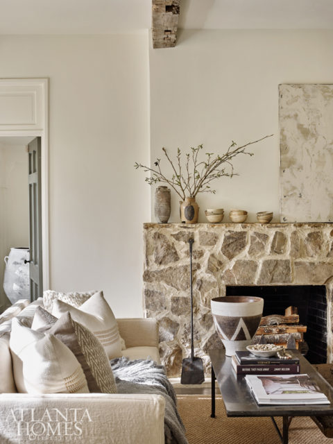 The Weitzes added antique beams and a stone fireplace to the formal living room in a recent renovation. The mantel features one-of-a-kind Asian pottery Debbie has on display at B.D. Jeffries, but it is not for sale. Olive jar, pillows and throw from B.D. Jeffries.