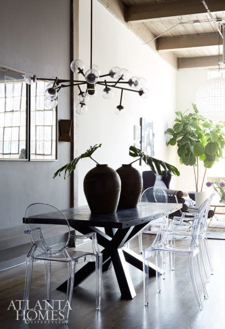 A custom bench along the wall in the dining area pulls double duty as a space saver while also increasing the seating capacity around the zinc-top table.
