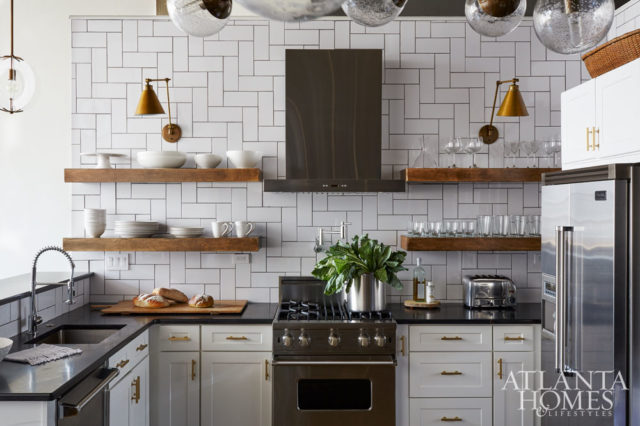 Hardy gutted the original kitchen to make way for this all-white room that’s a refreshing counterpoint to the loft’s moodier spaces.