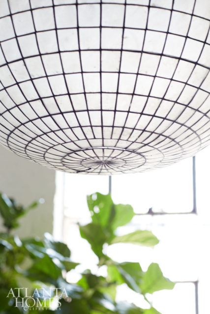 Restoration Hardware’s shell light pendant captures the loft’s unique and modern aesthetic.