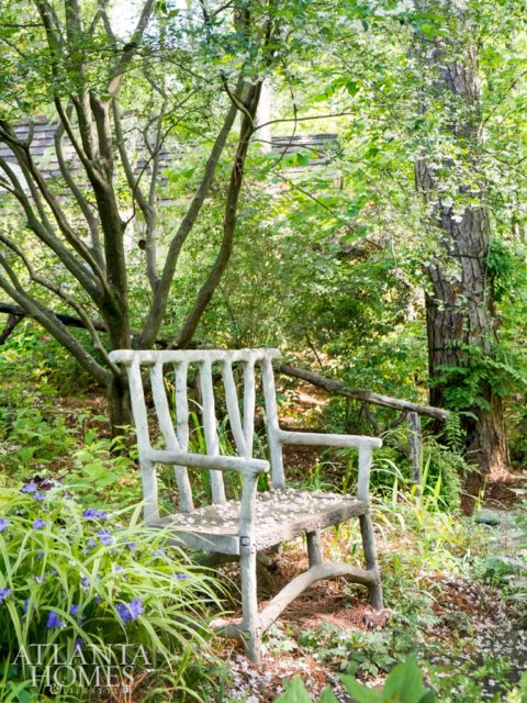 A faux-bois bench overlooks the pond.
