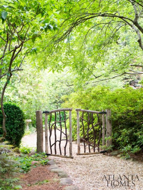 The rustic gate was made by Lake Rabun-based artisan Buz Stone.