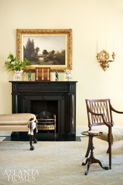 Striking accents, such as this black marble fireplace in the living room, attracted Banks to the home.