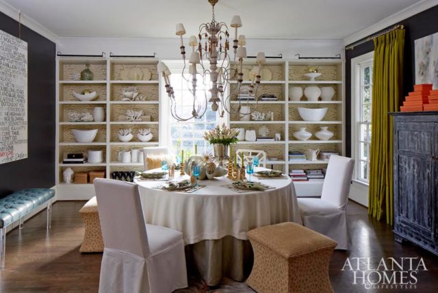The dining room’s seating arrangement captures eclectic spirit of homeowner and decorator Jennifer Schoenberger’s signature style. She selected the vibrant taffeta drapes after falling hard for them when she placed them in a client’s home.