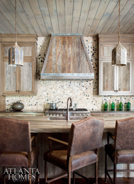The use of reclaimed wood continues in the kitchen with the cabinet fronts. “It’s a marriage of old and new,” says Beni Borza of Kingdom Woodworks.