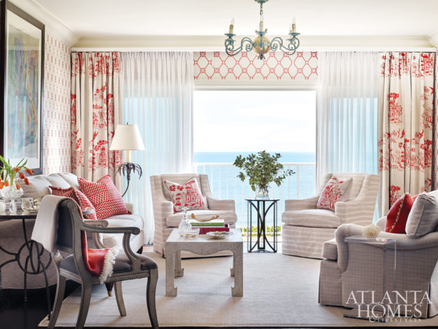 The lattice-inspired Nina Campbell wallpaper offers an updated retro effect and, as designer Carole Weaks notes, interacts beautifully with the overscaled Pam Heavner drapery print in the same shade. Beneath these, a layer of billowy sheers frames a breezy path to the porch.