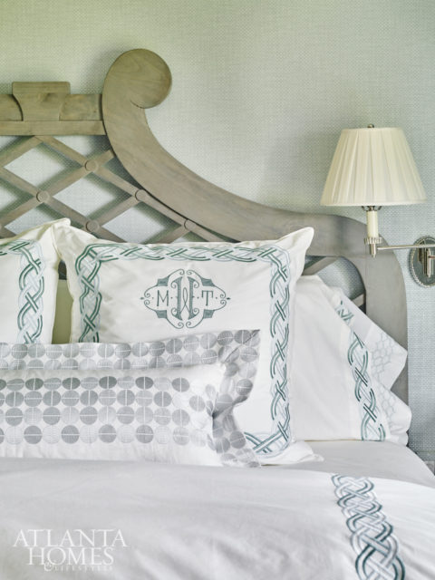Crisp monogrammed bed linens from The Linen Ladies share a calming shade of blue with the rest of the master bedroom.