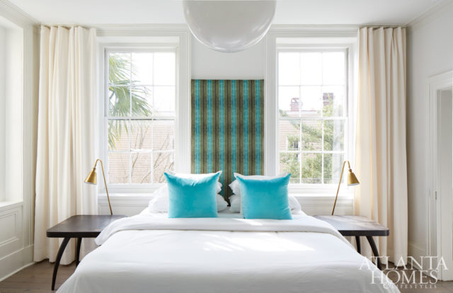 The master bedroom reflects Kay’s efforts to keep everything as light and airy as possible. Even a low headboard would have blocked the windows to King Street, so she devised the blue-and-green velvet panel, which adds a wow factor while anchoring the king-size sleeping spot.