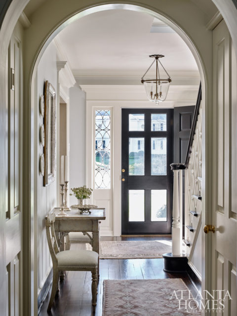 William B. Litchfield and Jackye Lanham refreshed this 1938 Colonial Revival cottage with a light palette and period-appropriate architectural details inside to “charm the house up,” says Litchfield.