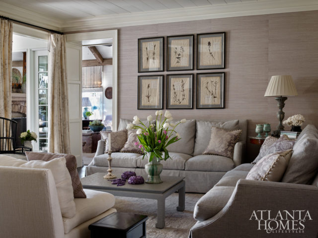 Lanham covered the living room walls in a pale lavender grass cloth from Schumacher. The antique pressed botanicals were ones that the designer had “hoarded for many years,” she laughs. “I could only let them go to someone who would love them as much as I do, and I knew this homeowner would.”