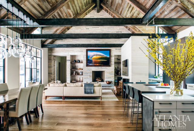 Patrick envisioned an open floor plan with a mix of industrial details, like exposed metal beams and steel windows, and warm materials, including five varieties of woods from the floor to the ceiling.