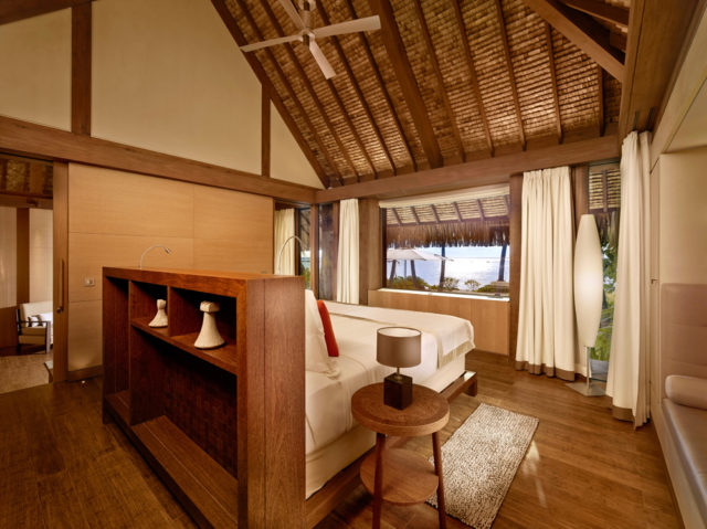 Natural woods and monochromatic bedding combine luxury and serenity.