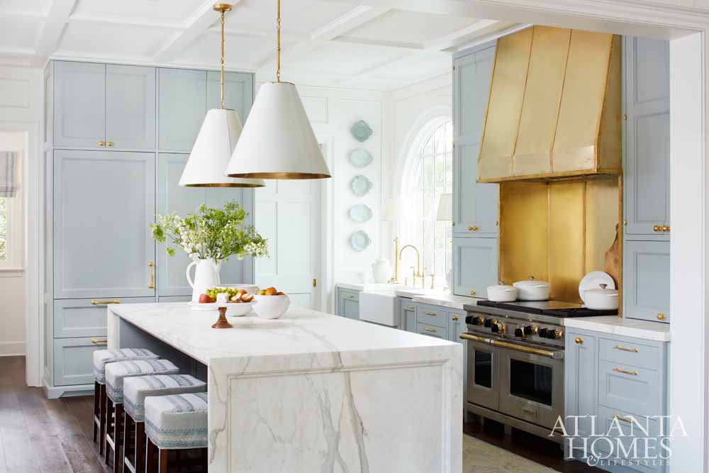 Light Blue and white kitchen with gold accents