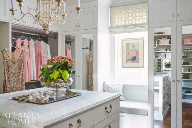When Quinn discovered the homeowner’s flair for fashion, he designed a showroom-like space to store and display her wardrobe and accessories. To match her unique organization process, Quinn added a combination of closets, open shelving and hanging racks, as well as a glass-lit Lucite purse shelf. “Design details, like Lucite pulls, light and bright walls, and the chandelier, prevent the clothes from dominating the space,” says Quinn.