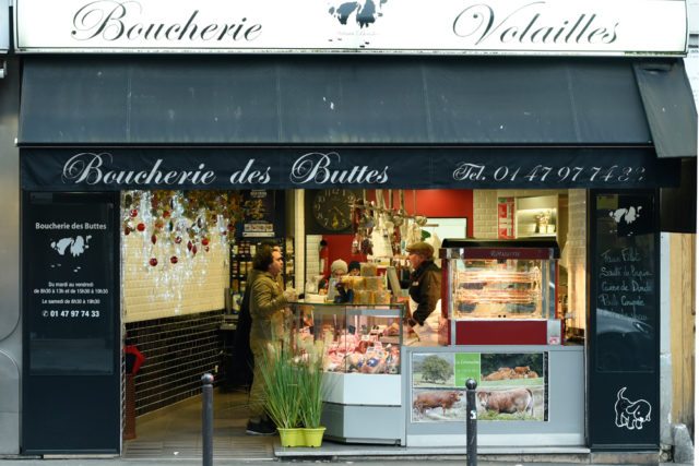 Paris A Dream food tour introduces guests to culinary experts, including local butchers in a Belleville, Paris, boucherie.