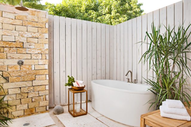 Enjoy a soak in a luxurious outdoor tub at one of Sailrock’s beachfront villas.