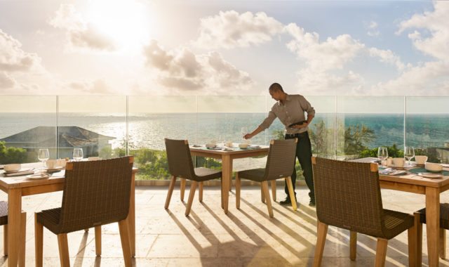 The Atlantic Ocean and Caicos Bank serve as the backdrop at Sailrock’s Great House Restaurant.
