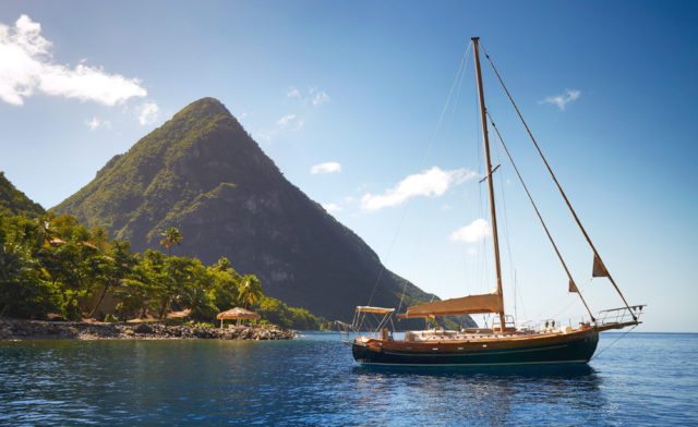 The boating lifestyle is celebrated at Jalousie Bay, with Gros Piton scraping the sky beyond.