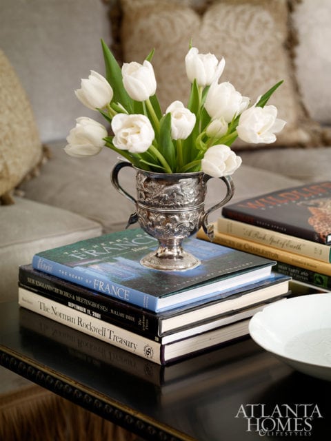 SILVER A good Atlanta hostess knows how to put silver into service, and a fresh-cut arrangement is an easy way to add elegance to any interior in a flash. Design by Jackye Lanham