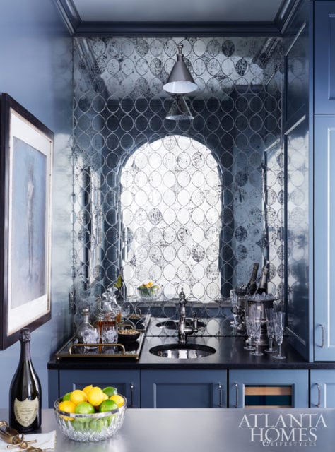 ANTIQUED GLASS Smoky glass tiles create time-honed appeal in smaller spaces. Design by Matthew Quinn