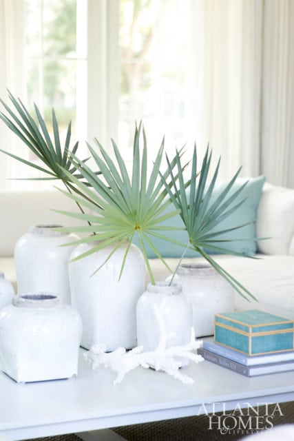 Color, texture and form combine to create a sense of easy elegance. A trestle table, sisal rug and contemporary art walk the balance between modern and timeless.