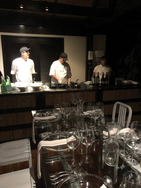 Chefs prepare a four course Gala Dinner live in a candlelit open-air rainforest bungalow.