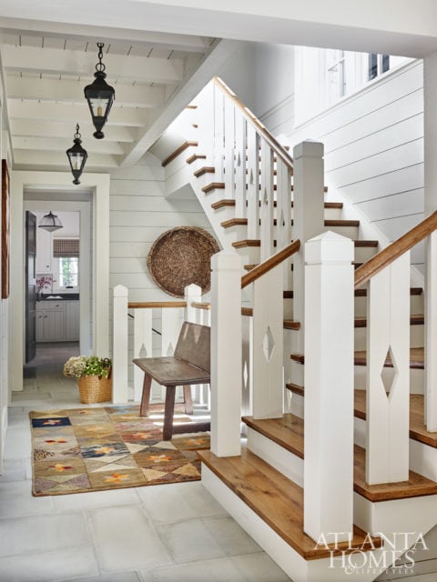 The staircase features a modern take on pickets.