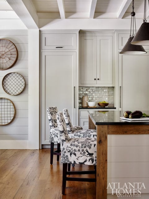 The island is accented with reclaimed oak to link back to the family room’s wood beams for a sense of continuity.