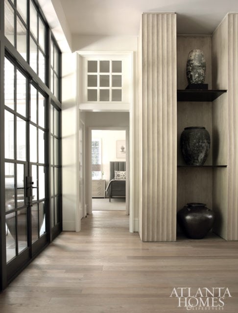 The homeowners have long collected fine pottery, so the design team—led by interior designer Tish Mills Kirk and architectural designer Joel Kelly—delivered deceptively strong shelves for display. The white oak floors were a labor of love to reach the perfect finish. “The color is awesome for hiding soil, as well as wear and tear from pets,” Mills Kirk says.