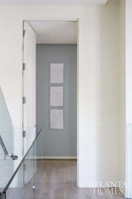 A series of sketches by artist Sally King Benedict add intrigue to a wall leading into one of the bedrooms.