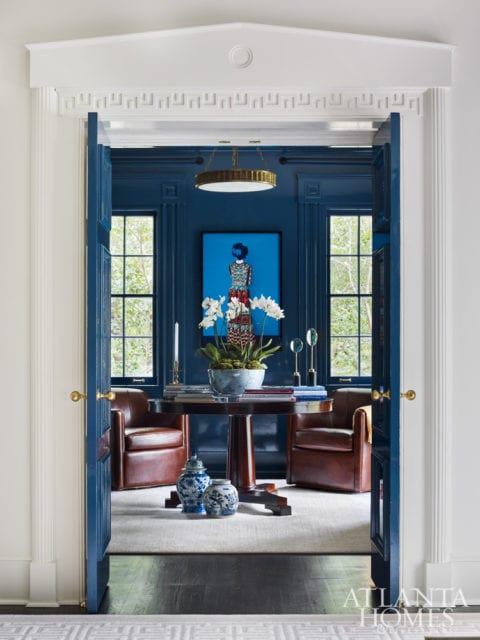 A photograph by Erik Madigan Heck, through Jackson Fine Art, holds court in the lacquered reading room.
