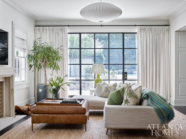 Embracing the couple’s former California lifestyle, the family room takes on a more relaxed ambience.