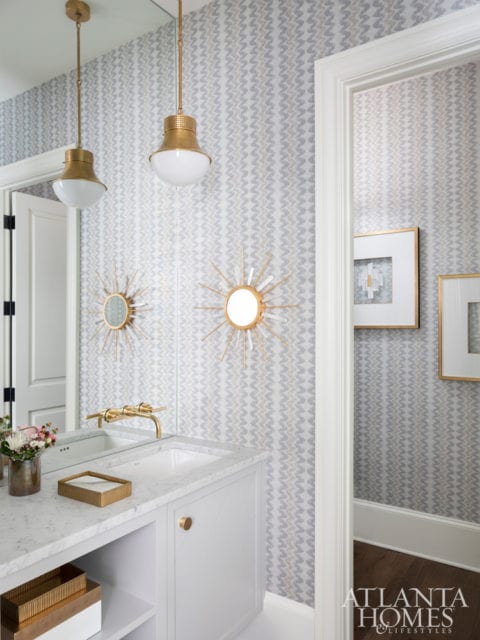 Cowtan & Tout’s Shiva wallcovering adds gravitas to the powder room without feeling too staid. A brass pendant by Kelly Wearstler for Circa Lighting plays off the brass plumbing fixtures and a few of Bradley’s well-chosen accessories.