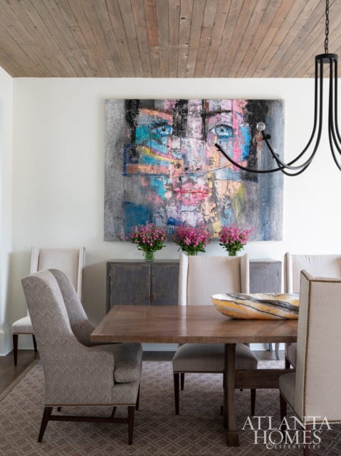 The dining room is anchored by a large-scale mixed-media piece by Fabio Modica, represented through Bill Lowe Gallery.