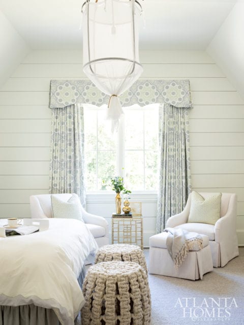 This ethereal guest suite is Bradley’s favorite room in the house. The first element the designer selected was a “campy” ceiling pendant featuring a layer of mesh; a pair of rope-adorned drum stools anchor the space at the foot of the bed.