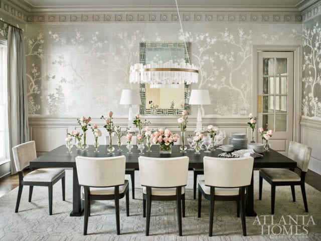 A traditional wall covering by Gracie Studio juxtaposes the modern table and chairs from Christian Liaigre in the formal dining room. The rock crystal chandelier is by Coup D’Etat from R Hughes.