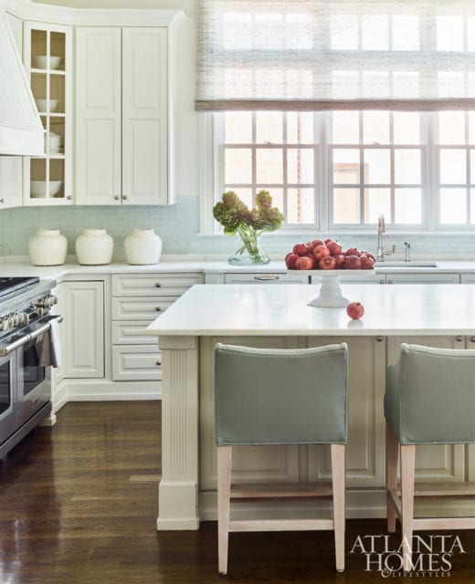 Statuary white marble countertops and newly painted cabinetry freshened up the already lovely kitchen without requiring a major renovation.