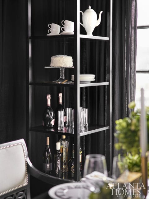 A black étagère from Baker’s Barbara Barry Collection keeps desserts, coffee and Champagne on hand.