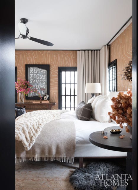 Kelly Wearstler’s Graffito wallpaper lends the master bedroom a graphic element. Wool draperies by Holland & Sherry add softness.