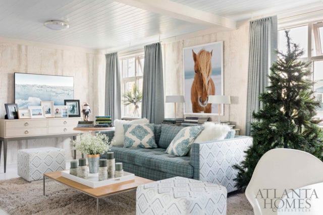 In classic Nordic style, Flynn’s contractor covered the living room walls in Thibaut’s Eastwood faux bois in a frosty gray tone. The Icelandic horse photo is by Rustic White Photography.